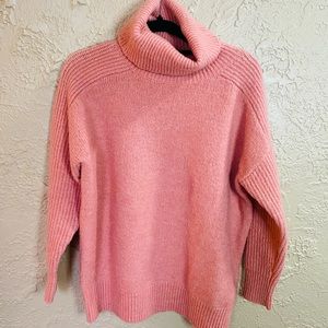 Pink turtleneck sweater